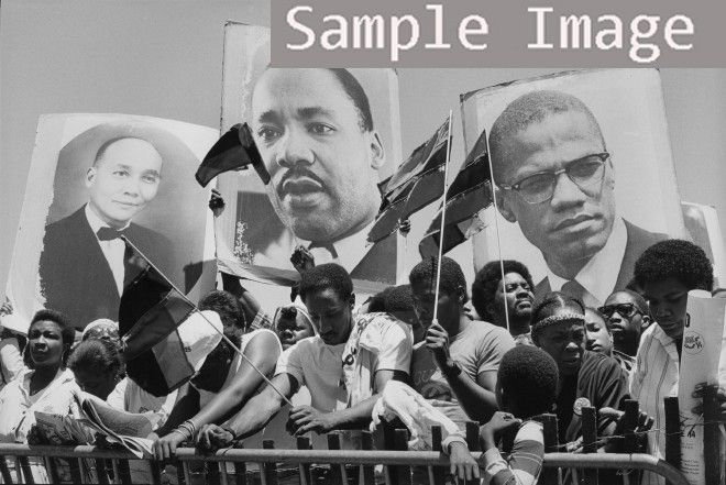 Description 1986 Three placards. Photograph shows a group of African 