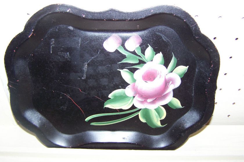 Gorgeous black tray with floral designs. Antique and unique  