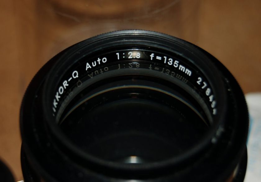 Lens is in great minty shape. Very light handling marks, no optical 