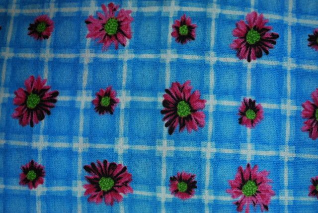 white checkered background with pink black lime daisies on top